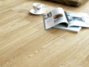 Close-up of White Oak timber flooring with a book and coffee cup – Wood & Wood Singapore