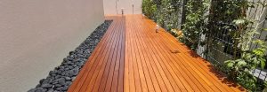 Outdoor timber decking with pebble border – Wood & Wood Singapore
